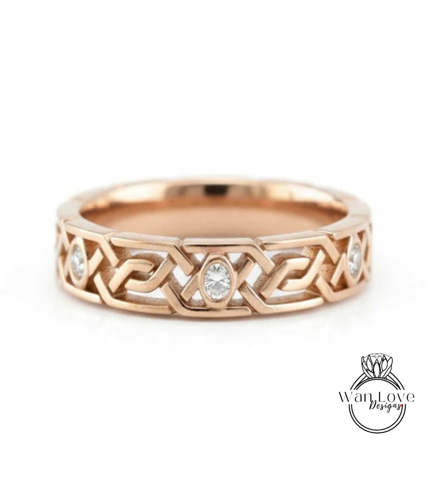 A gold ring with a Celtic knot design and a central oval-shaped diamond.