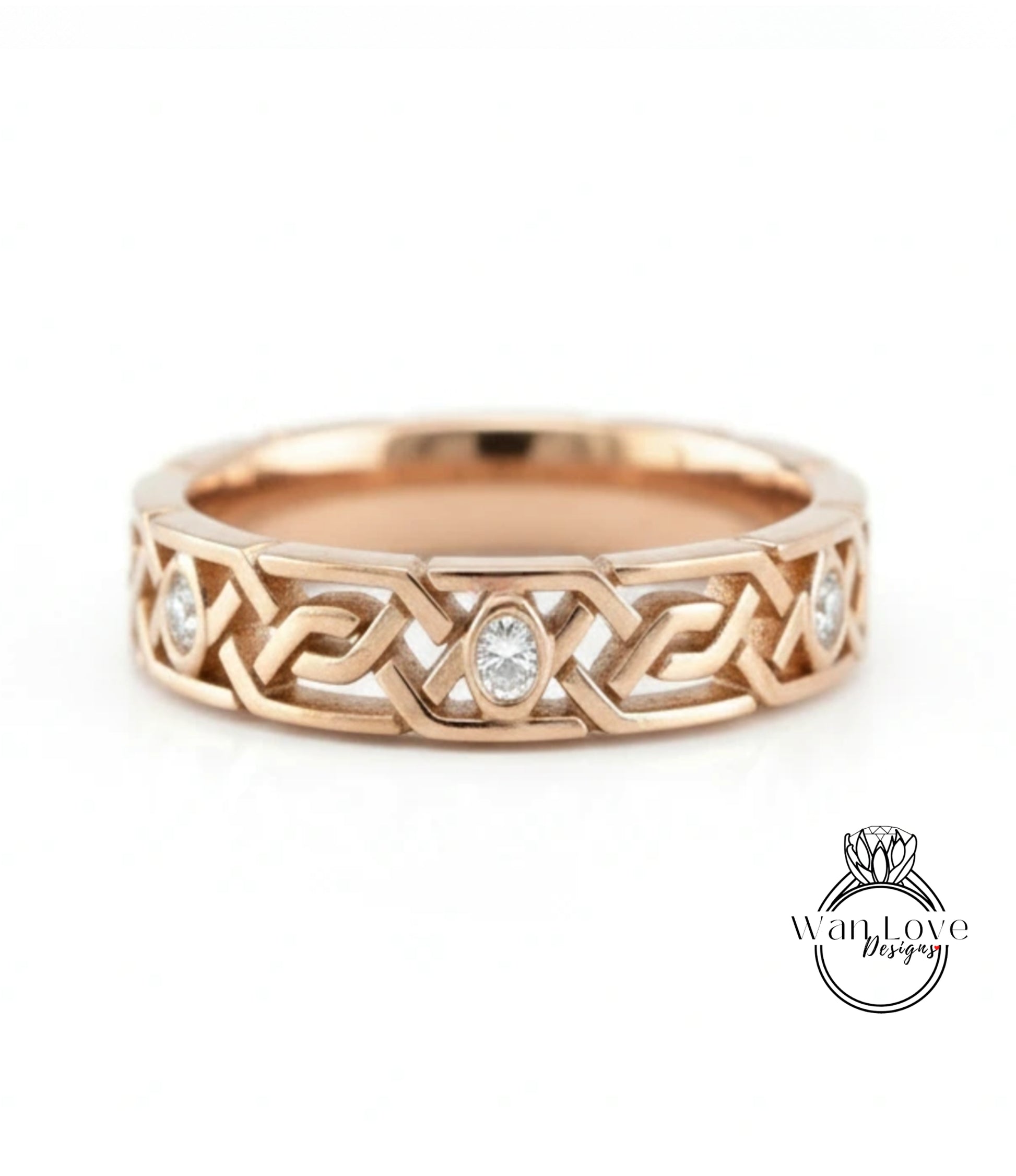 A gold ring with a Celtic knot design and a central oval-shaped diamond.