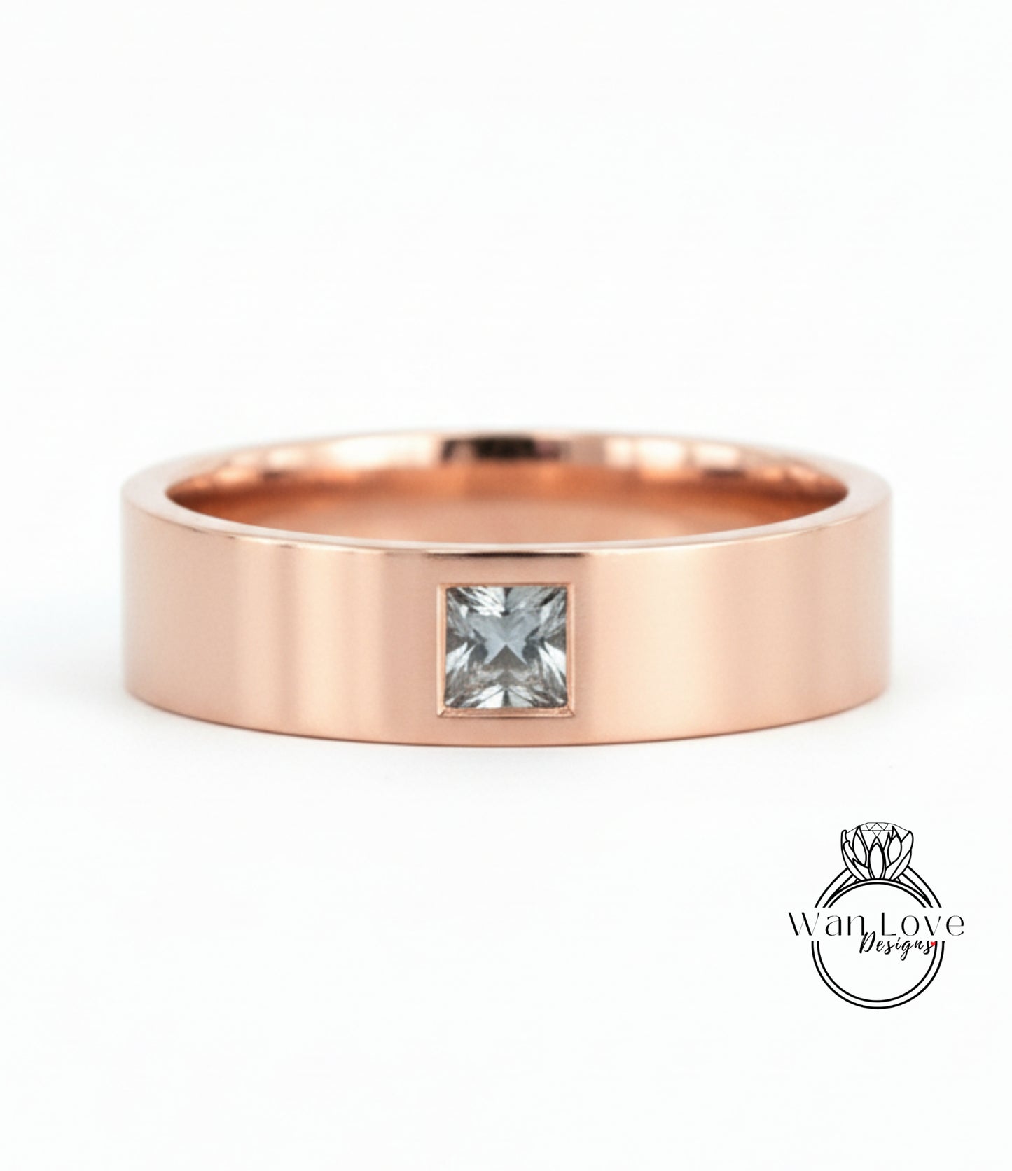 A rose gold band with a small square-cut diamond set in the center.