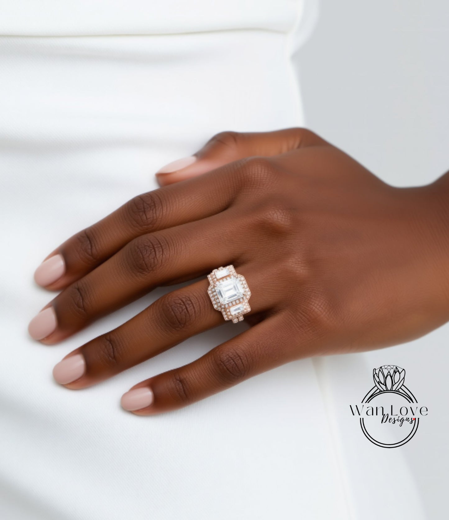 A close-up of a person's hand wearing a large, ornate ring with a diamond center stone.