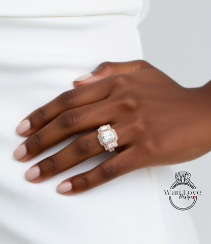 A close-up of a person's hand wearing a large, ornate ring with a diamond center stone.