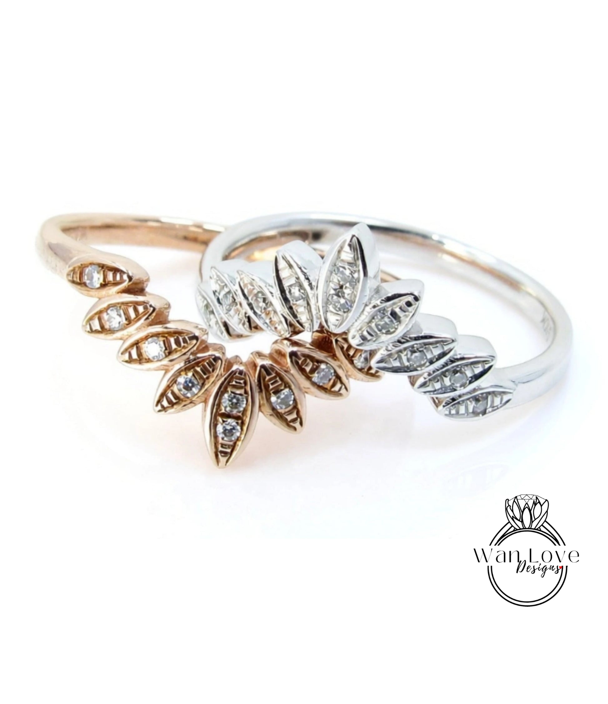 two rings with intricate designs, including a central ring with a large central flower-like element and smaller rings on either side.