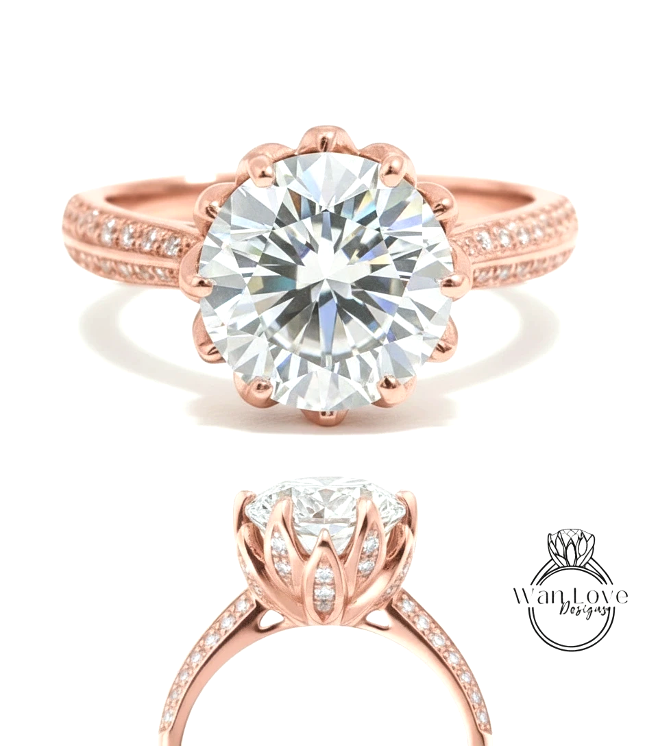 a beautiful rose gold engagement ring with a large, brilliant-cut diamond set in the center. The ring has a scalloped band and is adorned with small diamonds around the band.
