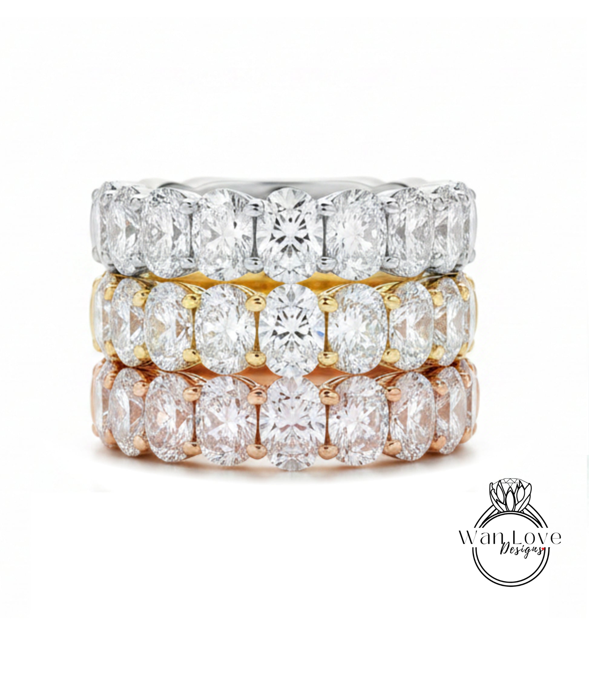 A stack of three rings with various colored diamonds set in the center.