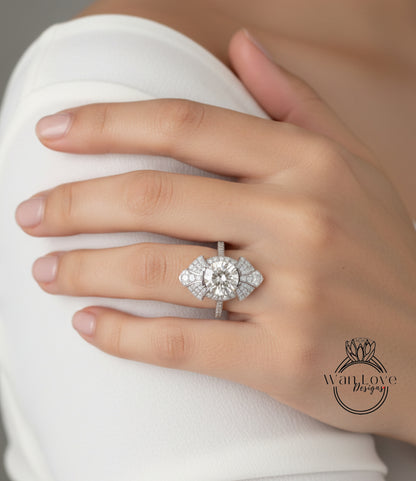 A close-up of a person's hand wearing a large, sparkling diamond ring on the ring finger.