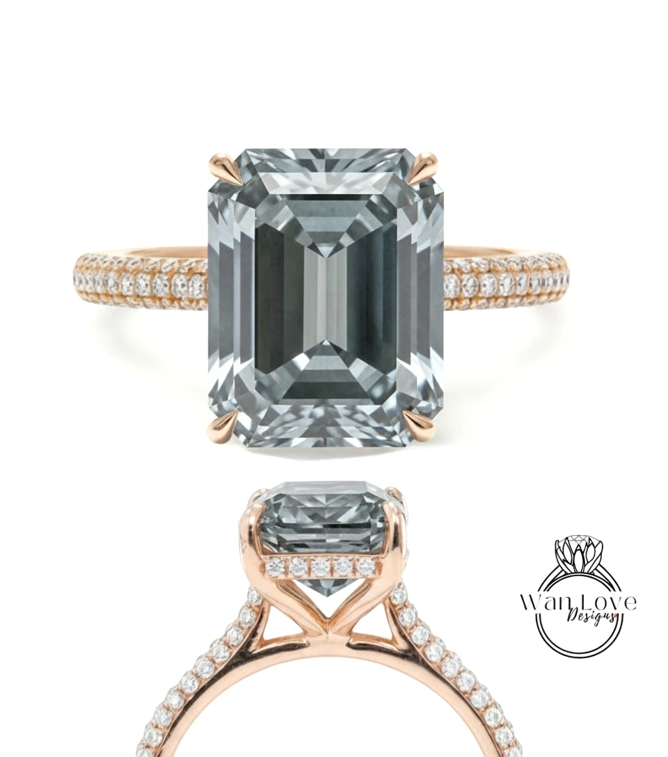 A large, rectangular-shaped diamond engagement ring with a gold band and small diamonds set in the band.