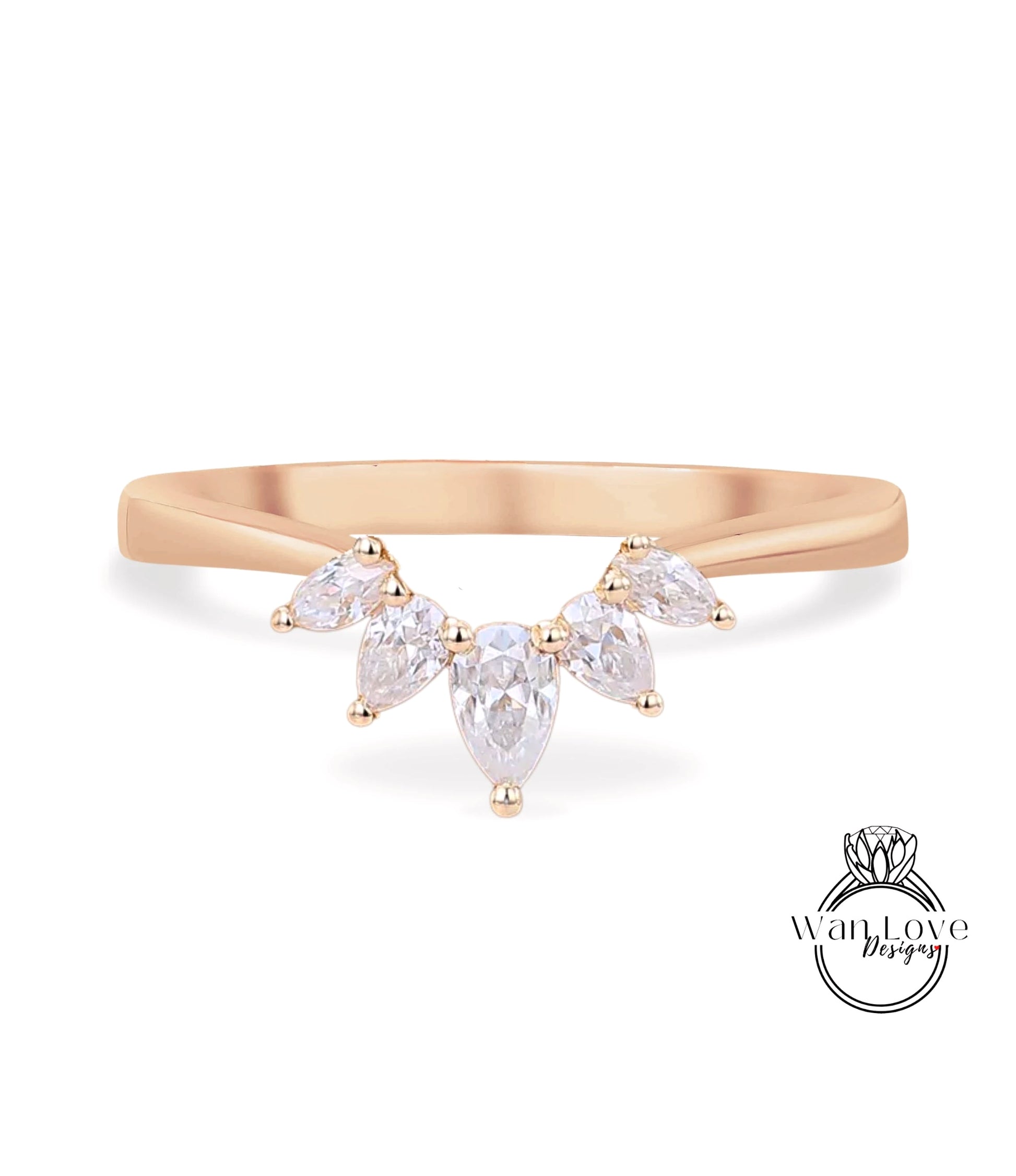 A gold ring with a large, clear gemstone set in the center, surrounded by smaller, clear gemstones.