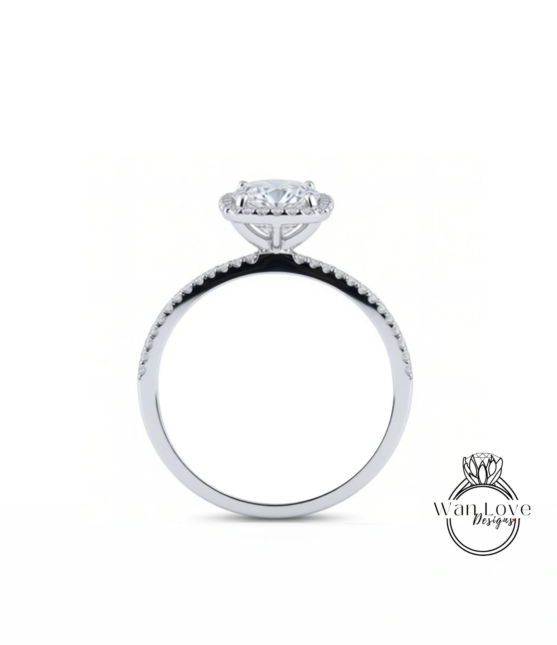 A silver engagement ring with a large central diamond and a halo of smaller diamonds around the top.