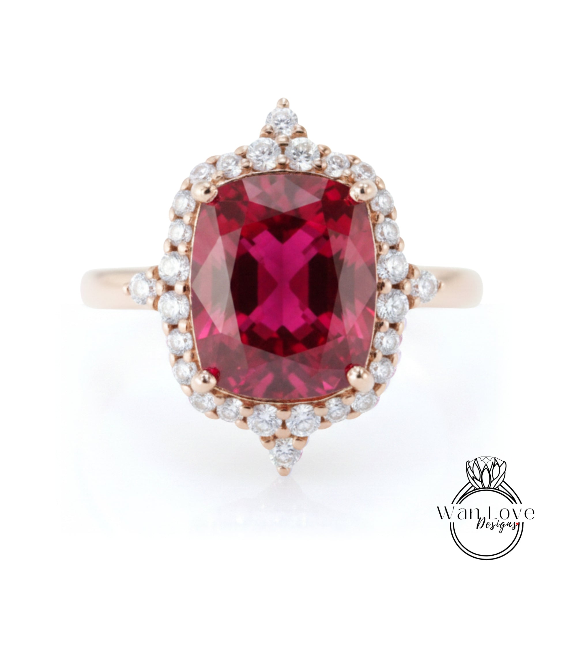 A large, vibrant red gemstone set in a gold ring with a halo of smaller diamonds around it.