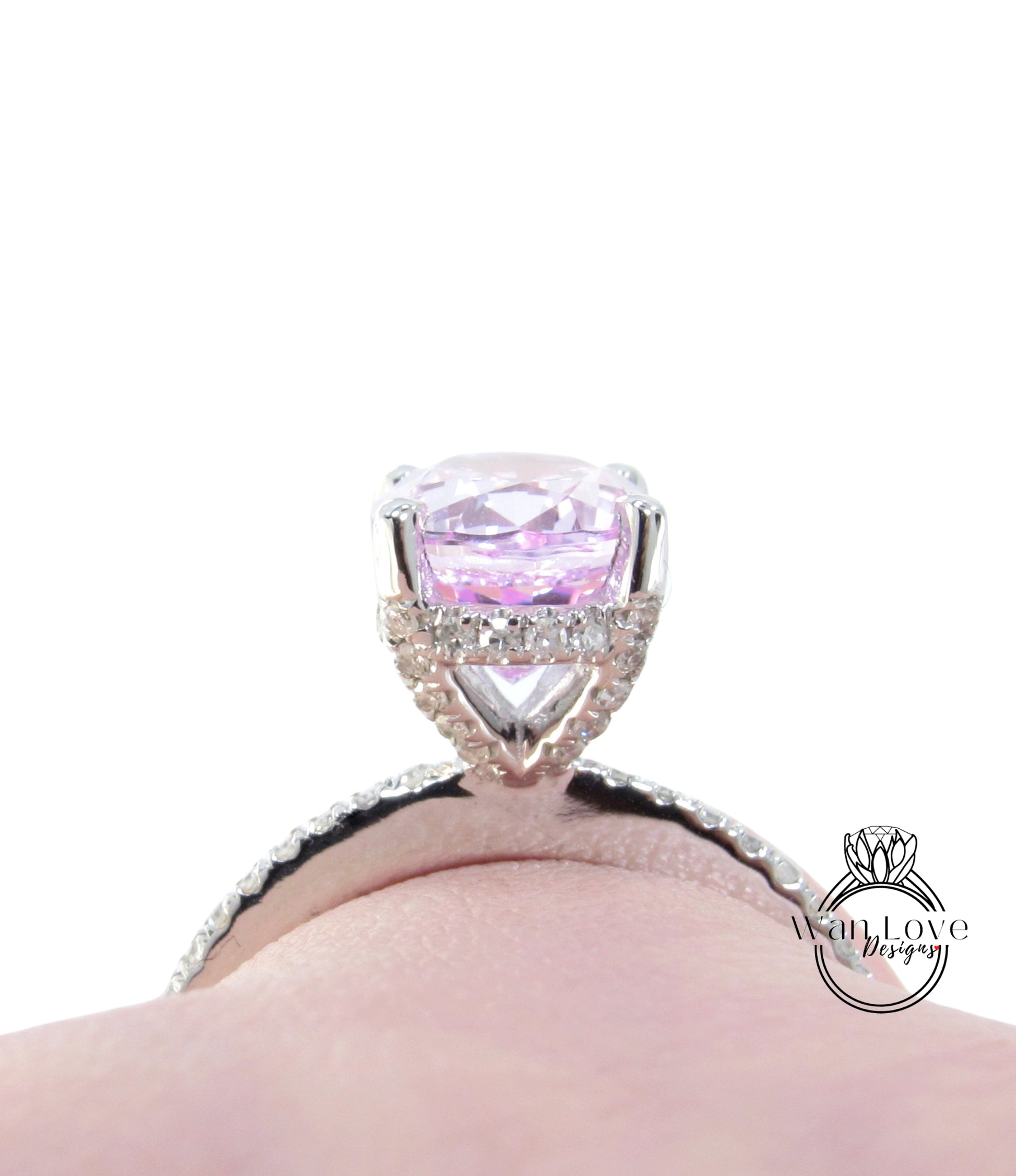 A close-up view of a diamond engagement ring with a large, clear gemstone set in a silver band.