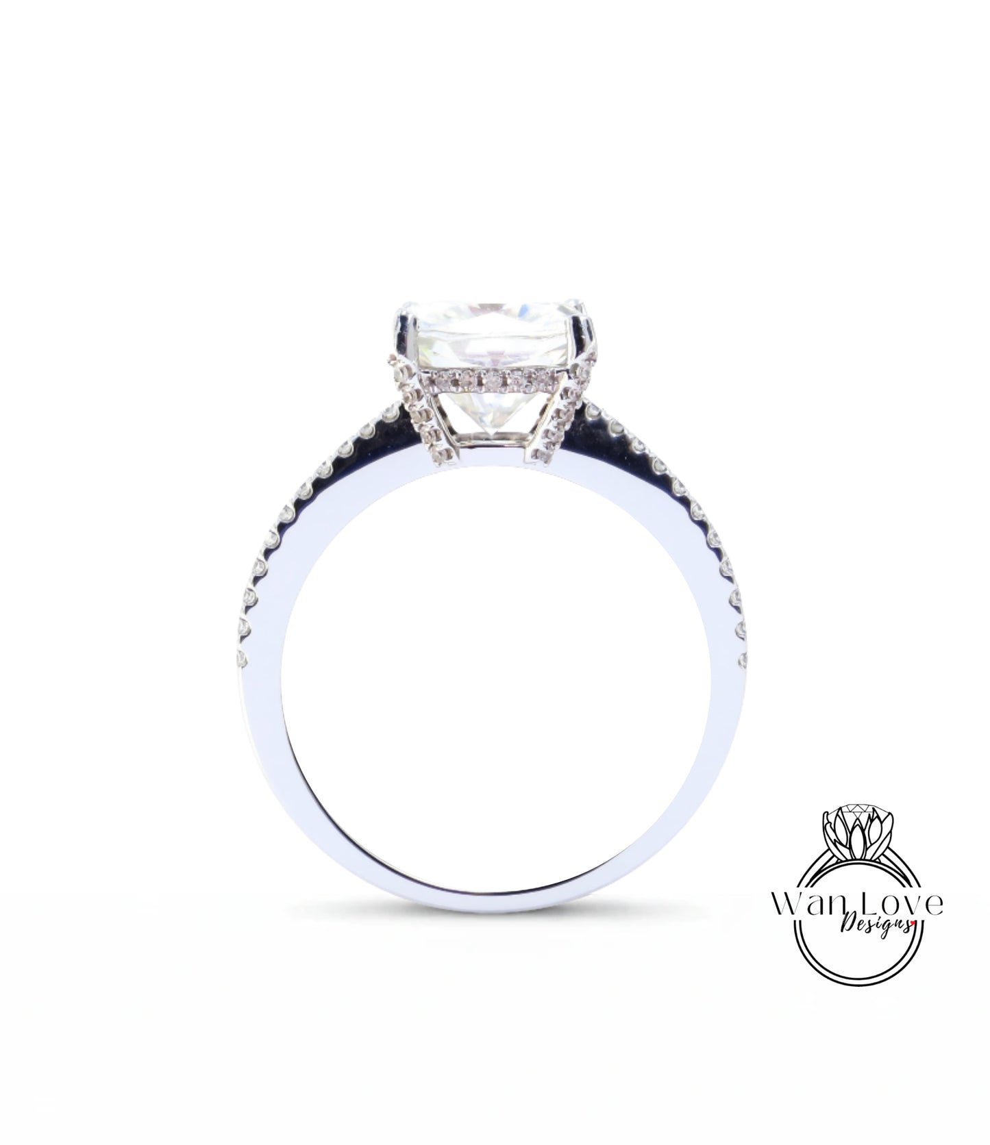 A close-up view of a diamond engagement ring with a large central diamond and smaller diamonds around the band.