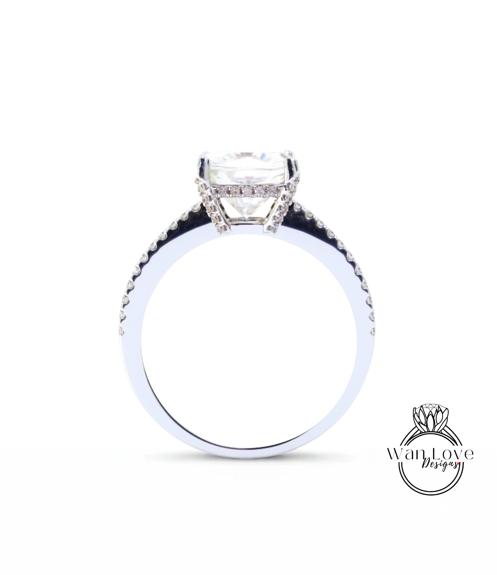 A close-up view of a diamond engagement ring with a large central diamond and smaller diamonds around the band.