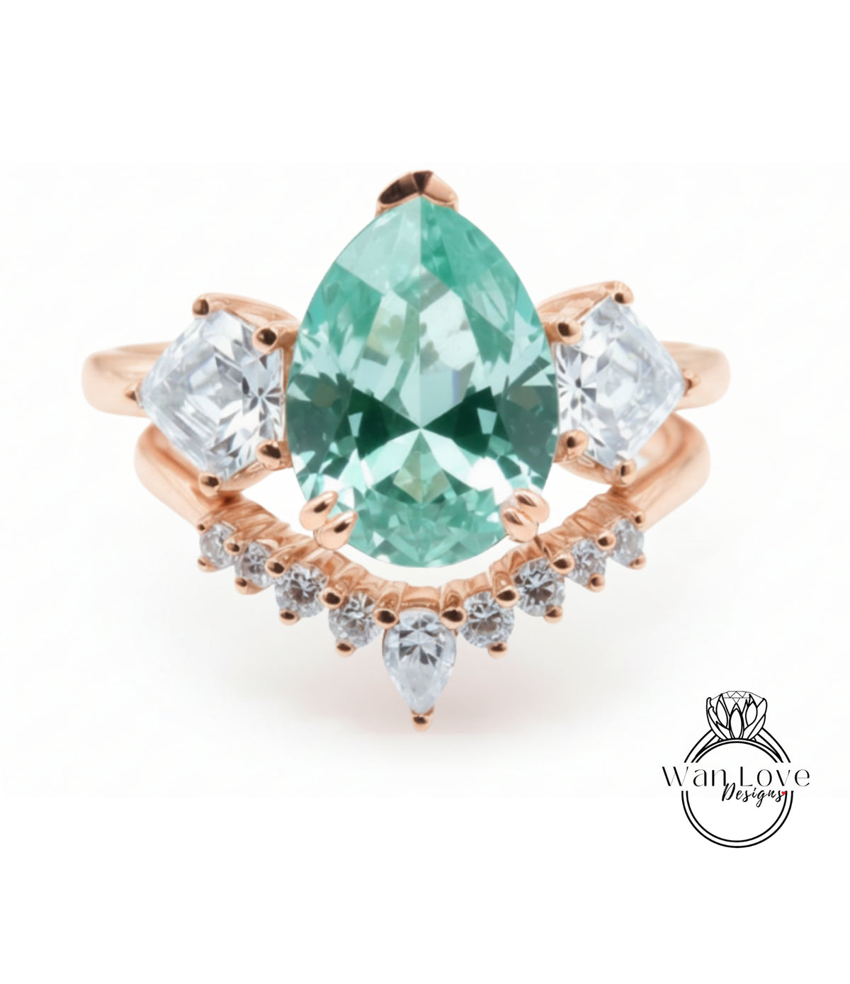 a beautiful ring with a large, green gemstone set in a rose gold band. The ring is adorned with smaller diamonds arranged in a decorative pattern around the band, creating an elegant and eye-catching design.