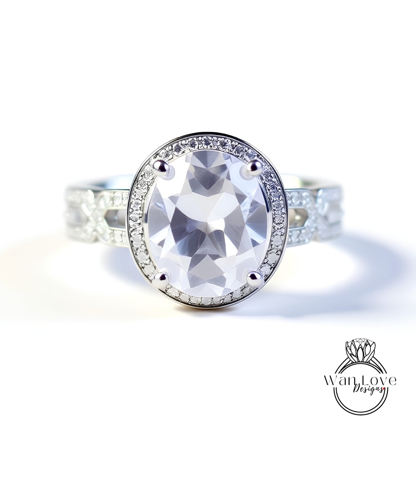 A close-up of a silver ring with a large oval-shaped gemstone, surrounded by smaller diamonds.
