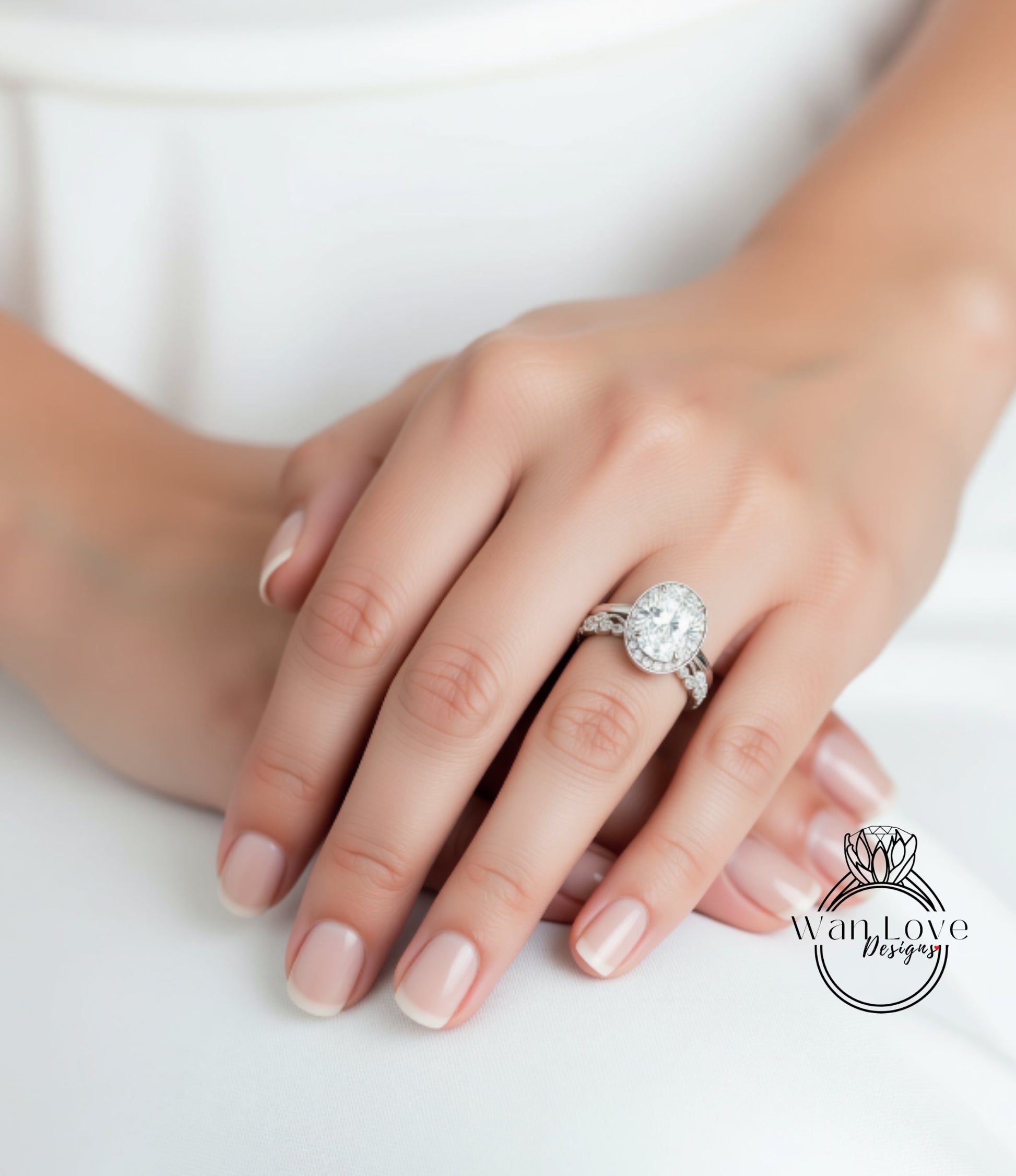 A close-up of a person's hand wearing a large diamond engagement ring.