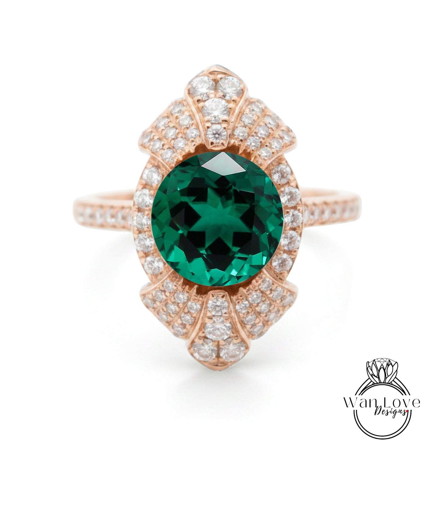 a beautiful ring with a large, green gemstone at the center, surrounded by a decorative pattern of smaller diamonds.