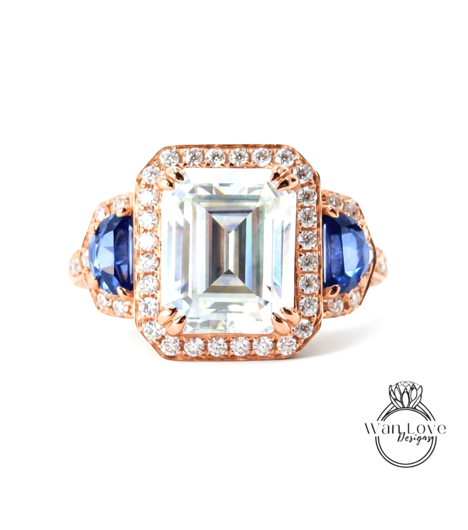 A large, clear gemstone ring with a halo of smaller diamonds around the center stone.