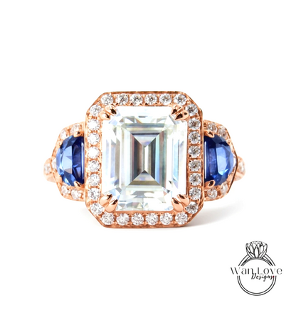 A large, clear gemstone ring with a halo of smaller diamonds around the center stone.