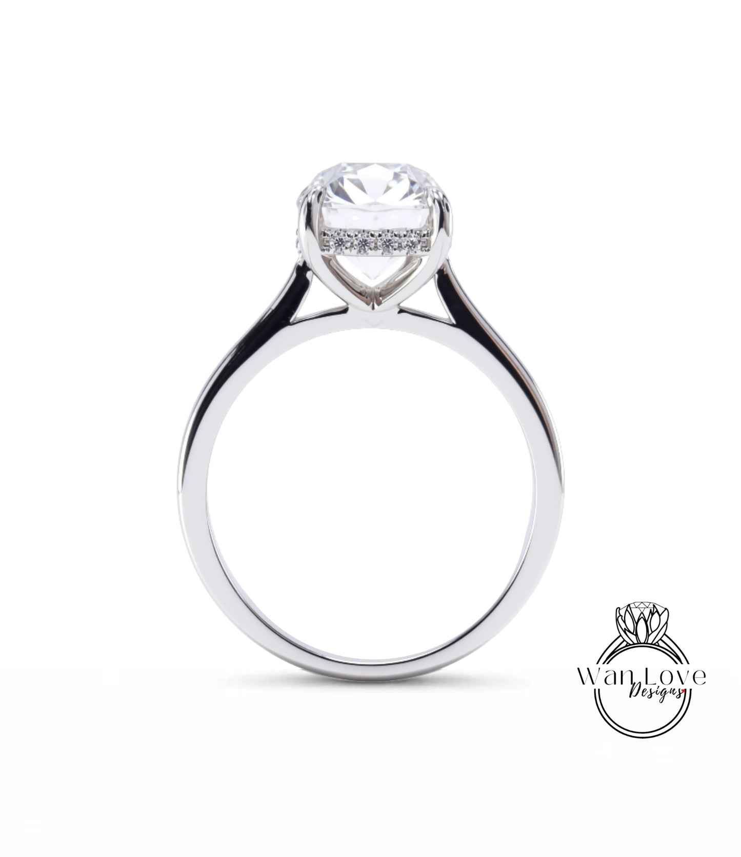 A close-up view of a silver engagement ring with a large, round diamond set in the center.