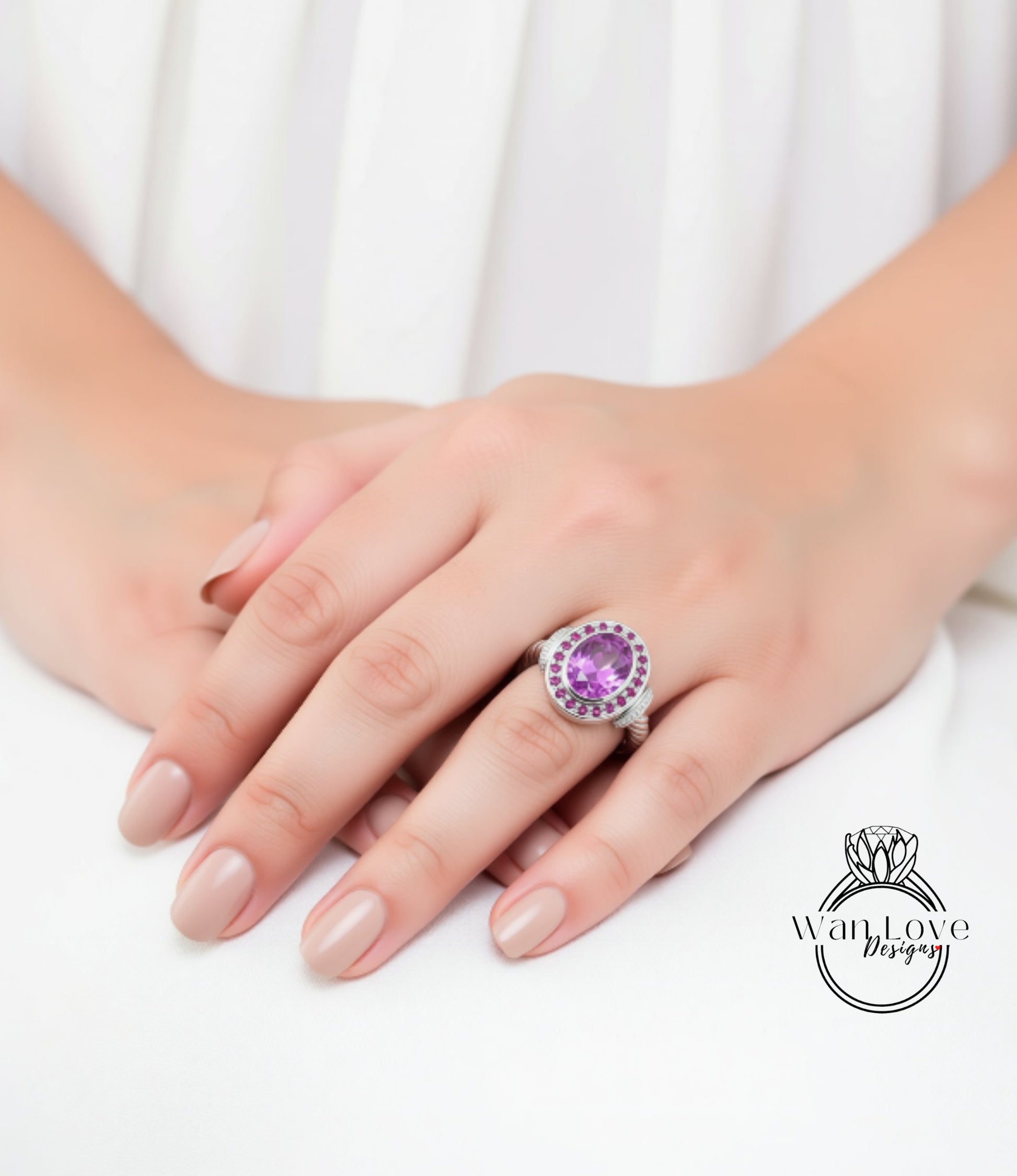 A close-up of a person's hands wearing a large, ornate ring with a purple gemstone.