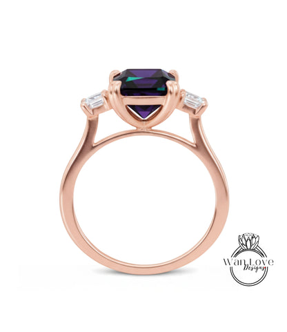 A rose gold ring with a large purple gemstone set in the center.