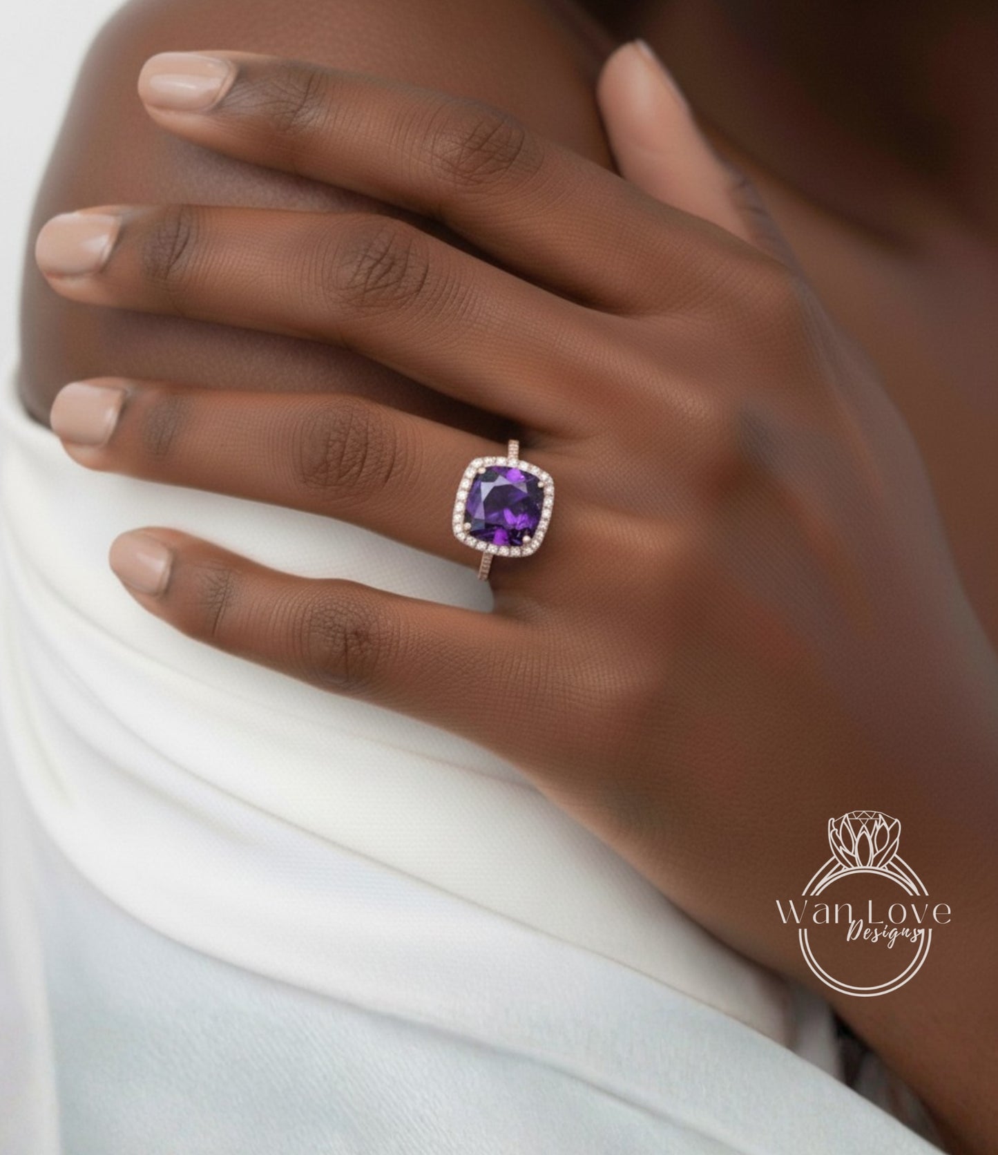 A close-up of a person's hand wearing a ring with a large purple gemstone.