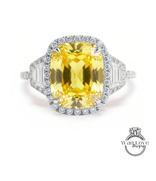 A large yellow gemstone ring with a halo of smaller diamonds around it.