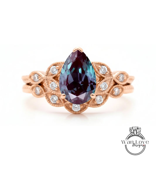 a beautiful engagement ring with a large, deep purple gemstone set in an ornate gold band.