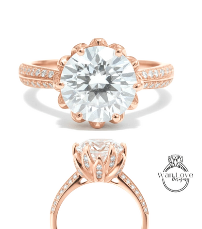 a beautiful rose gold engagement ring with a large, round diamond set in the center. The ring has a scalloped band and is adorned with small diamonds around the band.