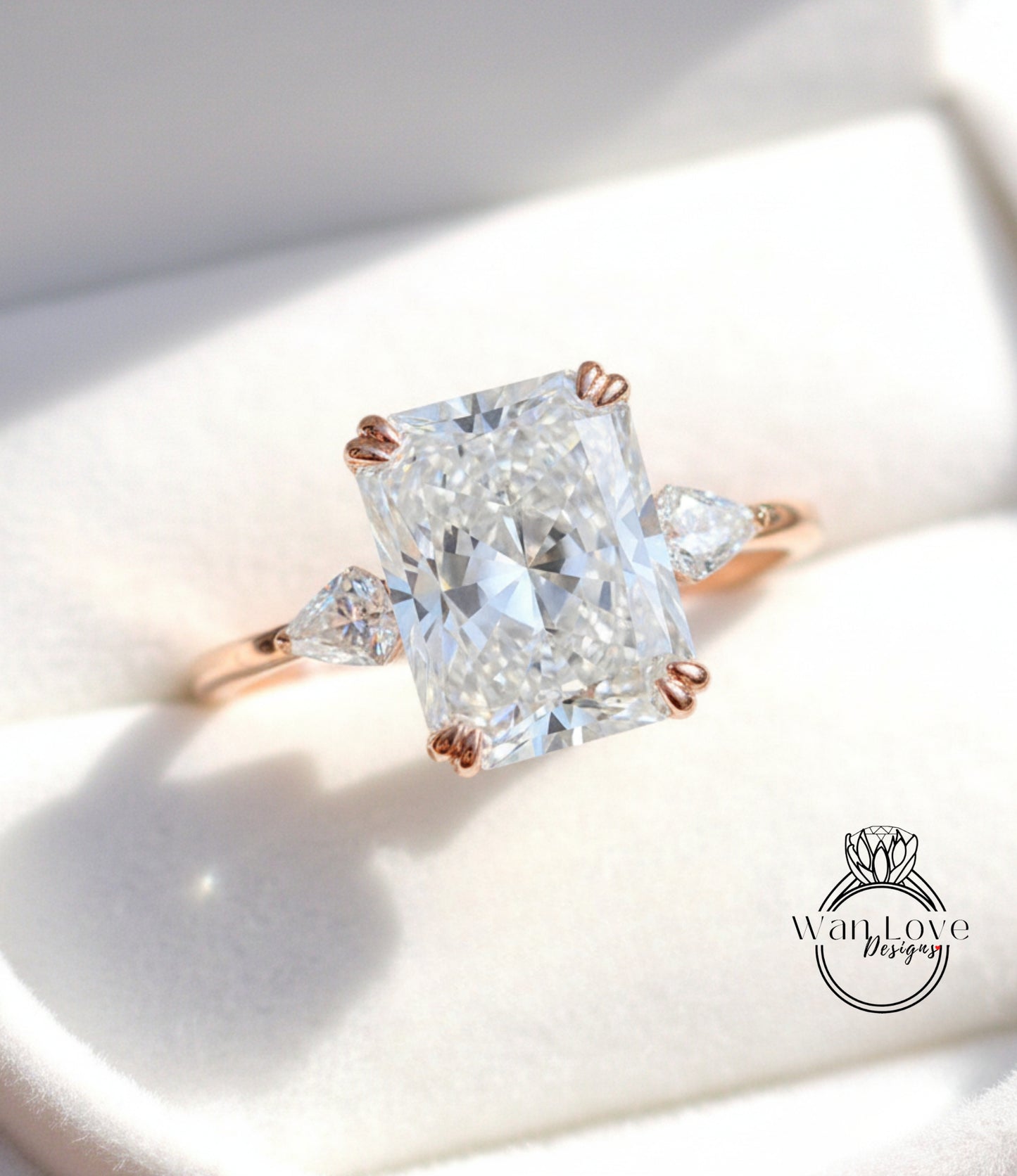 A close-up of a diamond engagement ring with a large, brilliant-cut diamond set in a rose gold band.