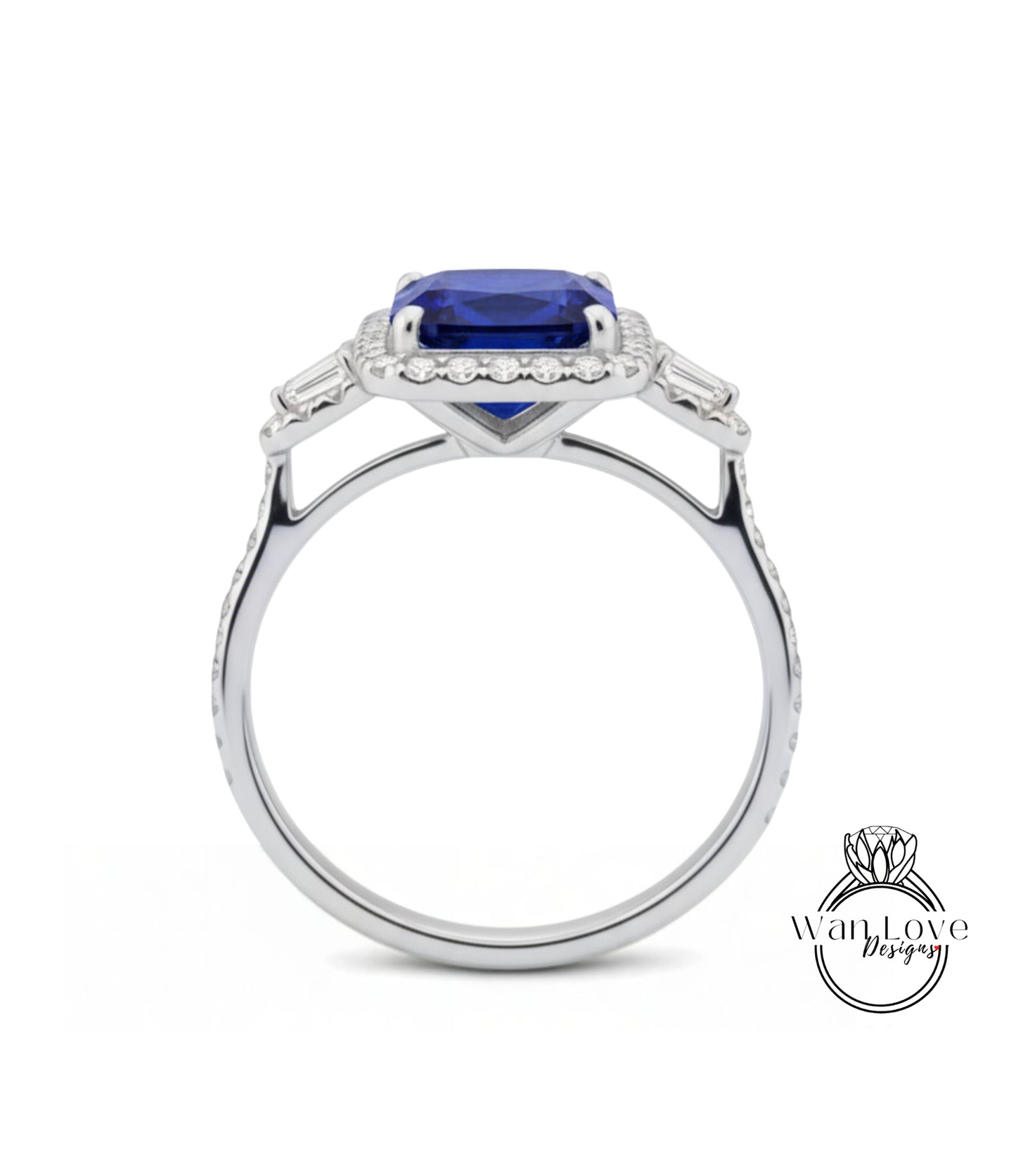 A silver ring with a large blue gemstone, likely a sapphire, set in a halo of smaller diamonds.
