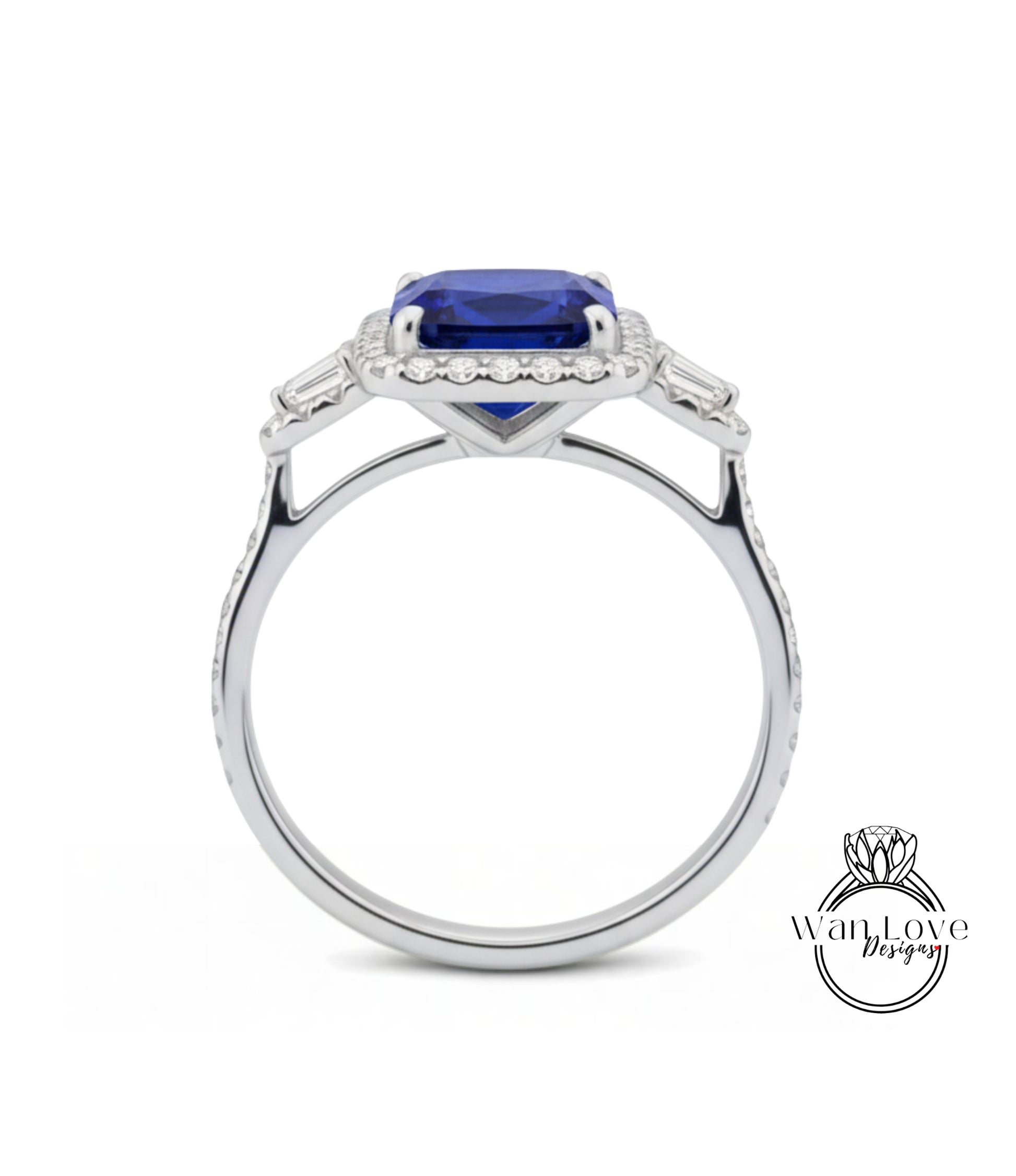 A silver ring with a large blue gemstone, likely a sapphire, set in a halo of smaller diamonds.