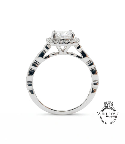 A close-up view of a silver engagement ring with a large central diamond surrounded by smaller diamonds.