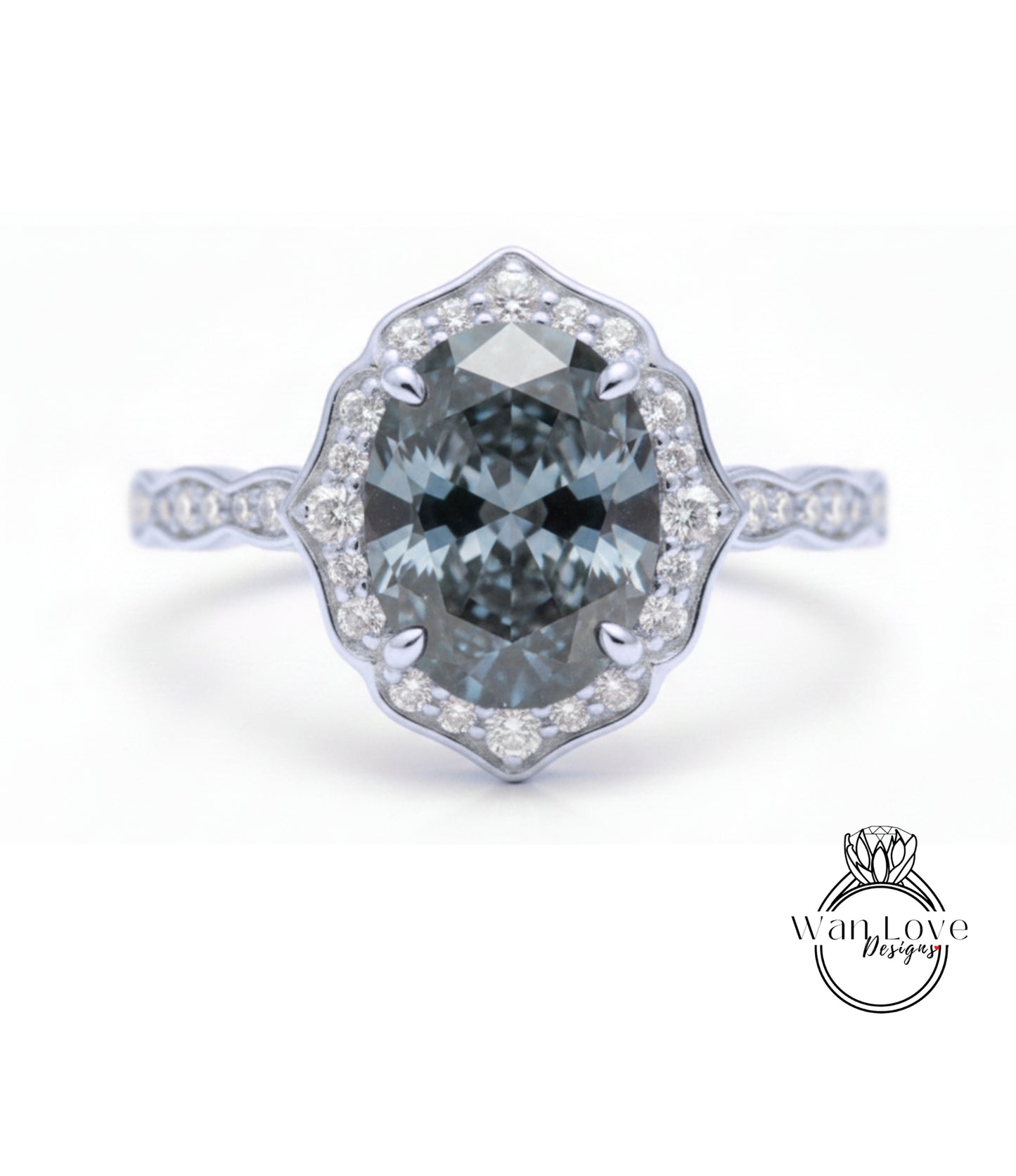 A silver ring with a large oval-shaped blue gemstone set in a halo of smaller diamonds.