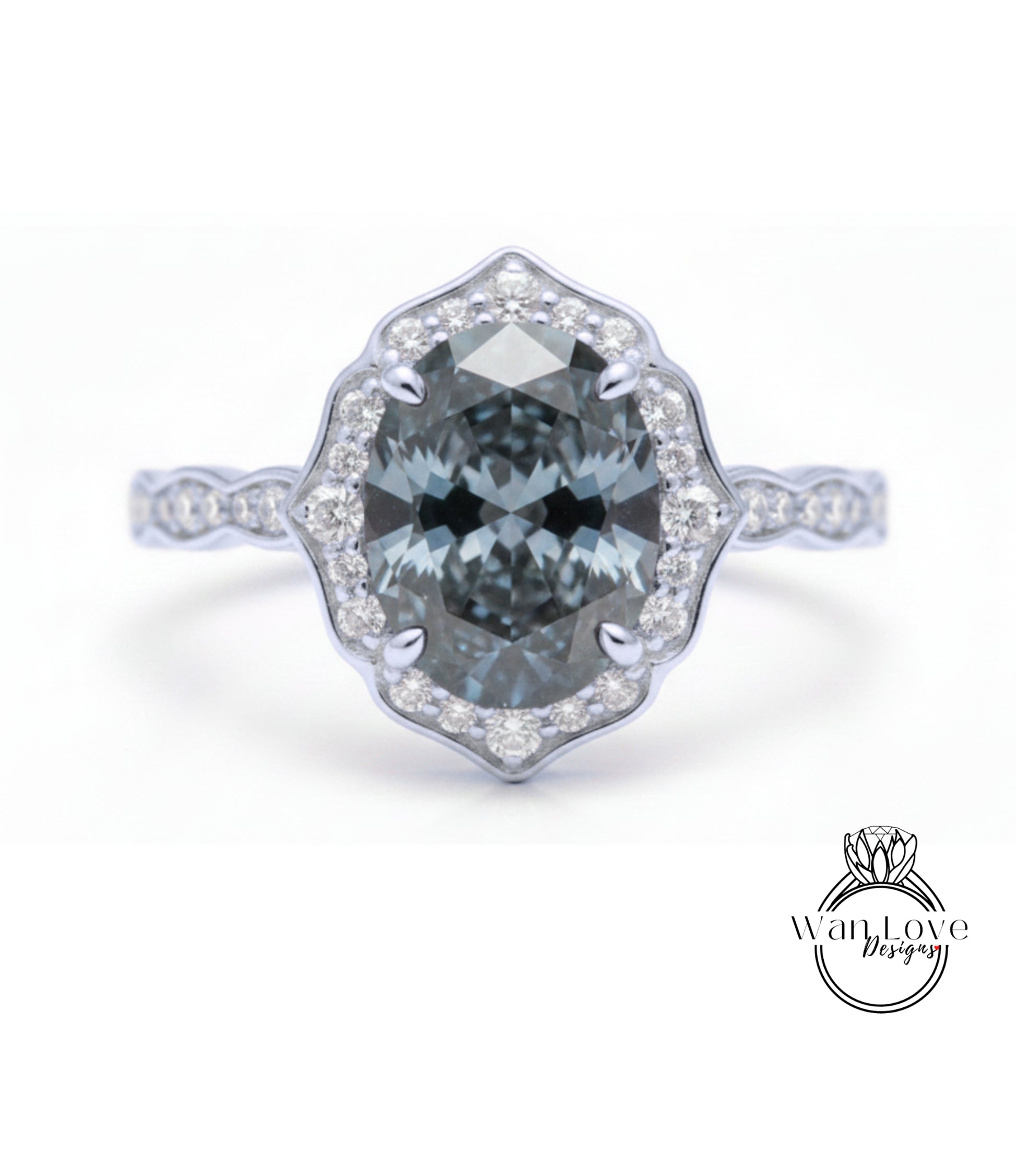 A silver ring with a large oval-shaped blue gemstone set in a halo of smaller diamonds.