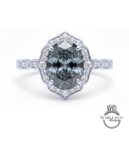 A silver ring with a large oval-shaped blue gemstone set in a halo of smaller diamonds.