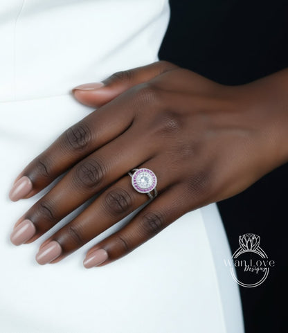 A close-up of a person's hand wearing a ring with a large, round gemstone.