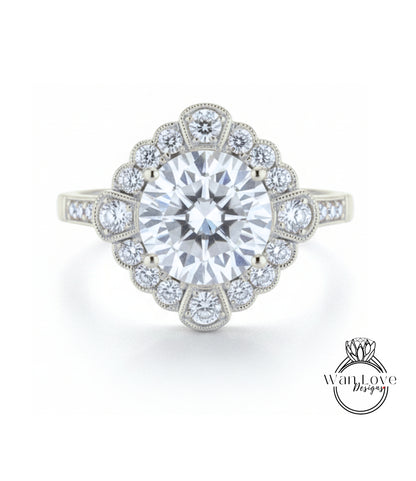 A stunning diamond engagement ring with a large central diamond surrounded by smaller diamonds set in a halo-like design.