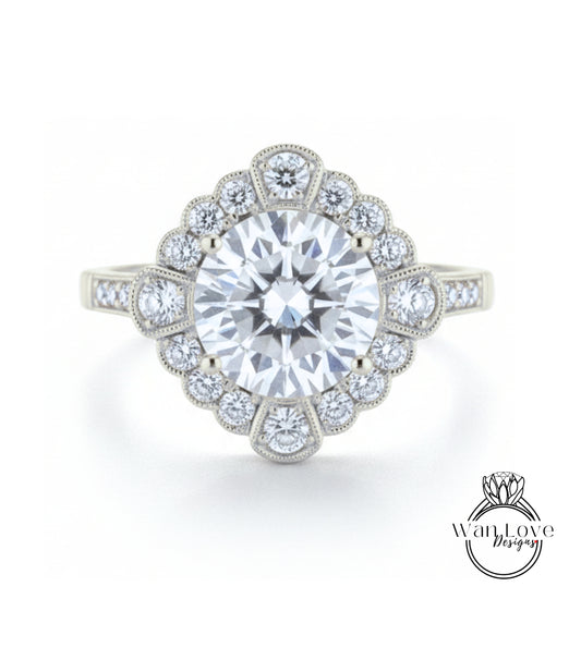 A stunning diamond engagement ring with a large central diamond surrounded by smaller diamonds set in a halo-like design.