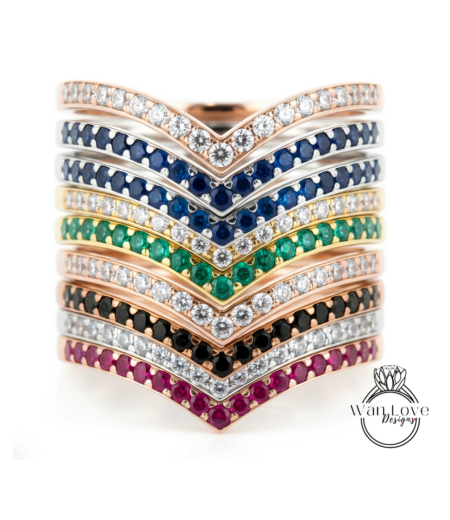 A stack of rings with various colored gemstones and diamonds set in a v-shaped design.