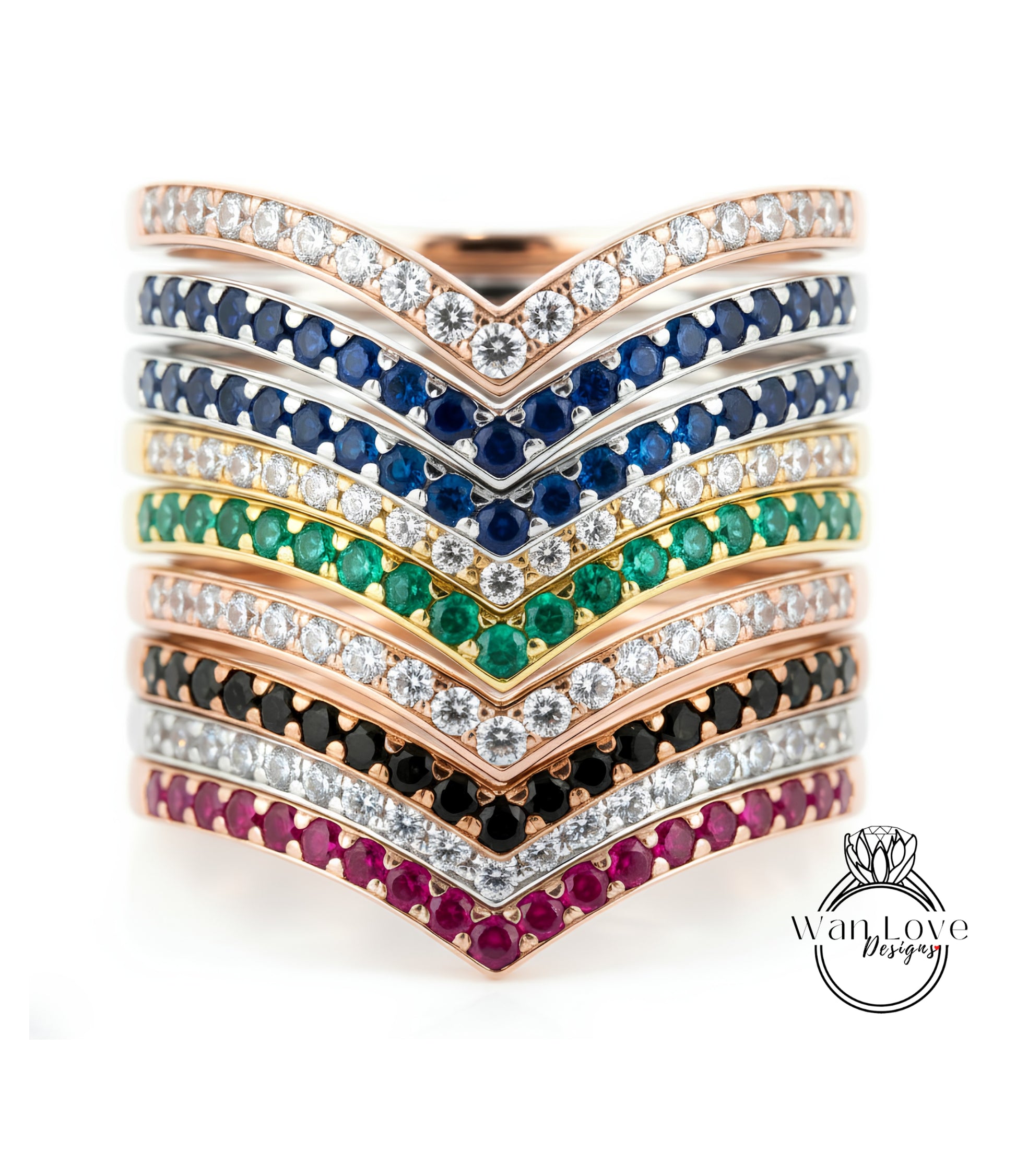 A stack of rings with various colored gemstones and diamonds set in a v-shaped design.