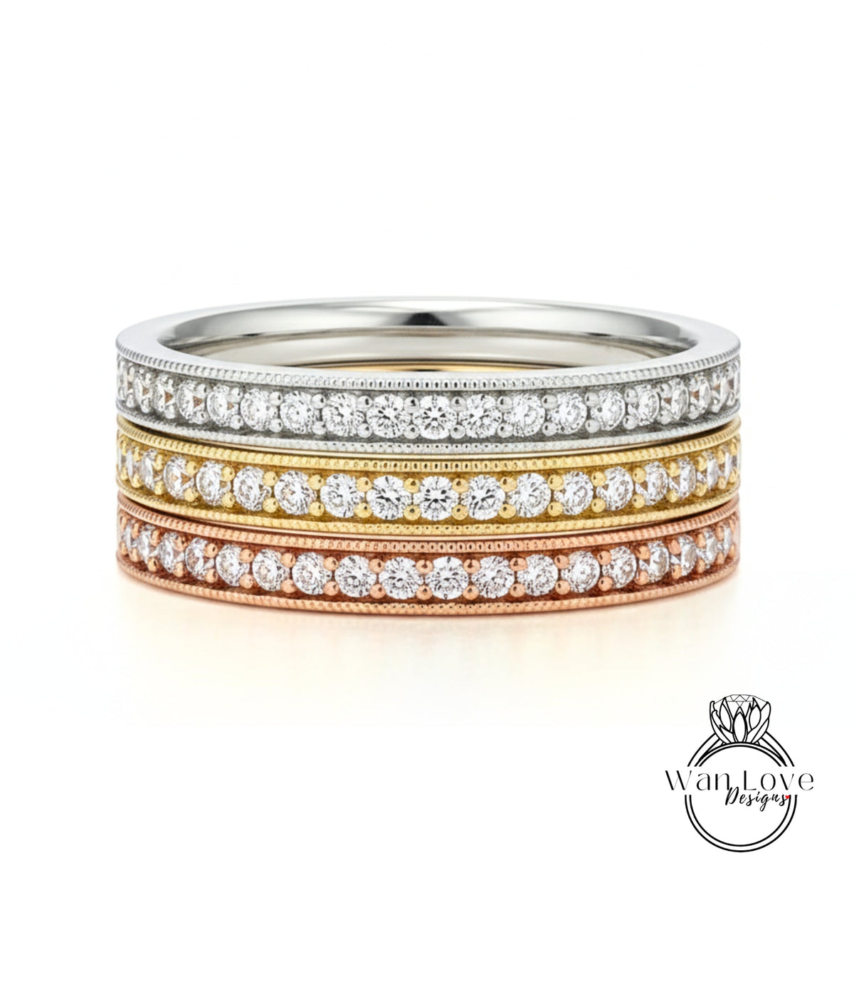 A ring with three concentric bands of diamonds, each band featuring a different color: silver, gold, and copper.
