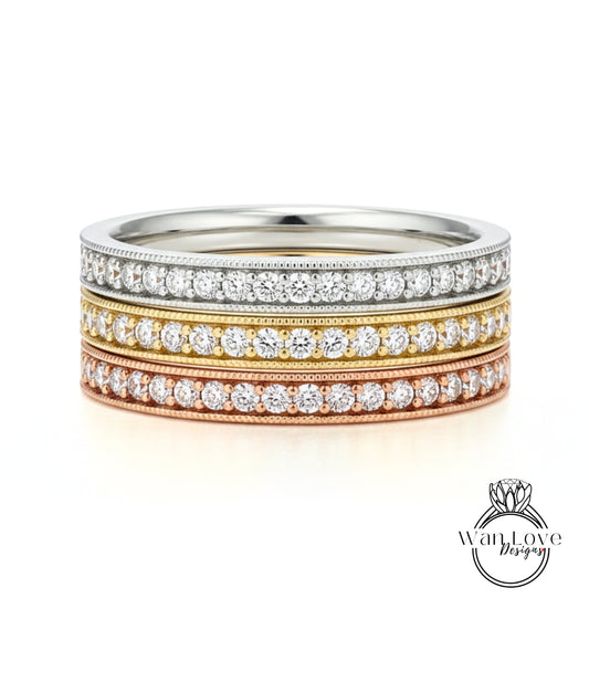 A ring with three concentric bands of diamonds, each band featuring a different color: silver, gold, and copper.
