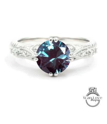 A silver ring with a large, deep blue gemstone at the center.
