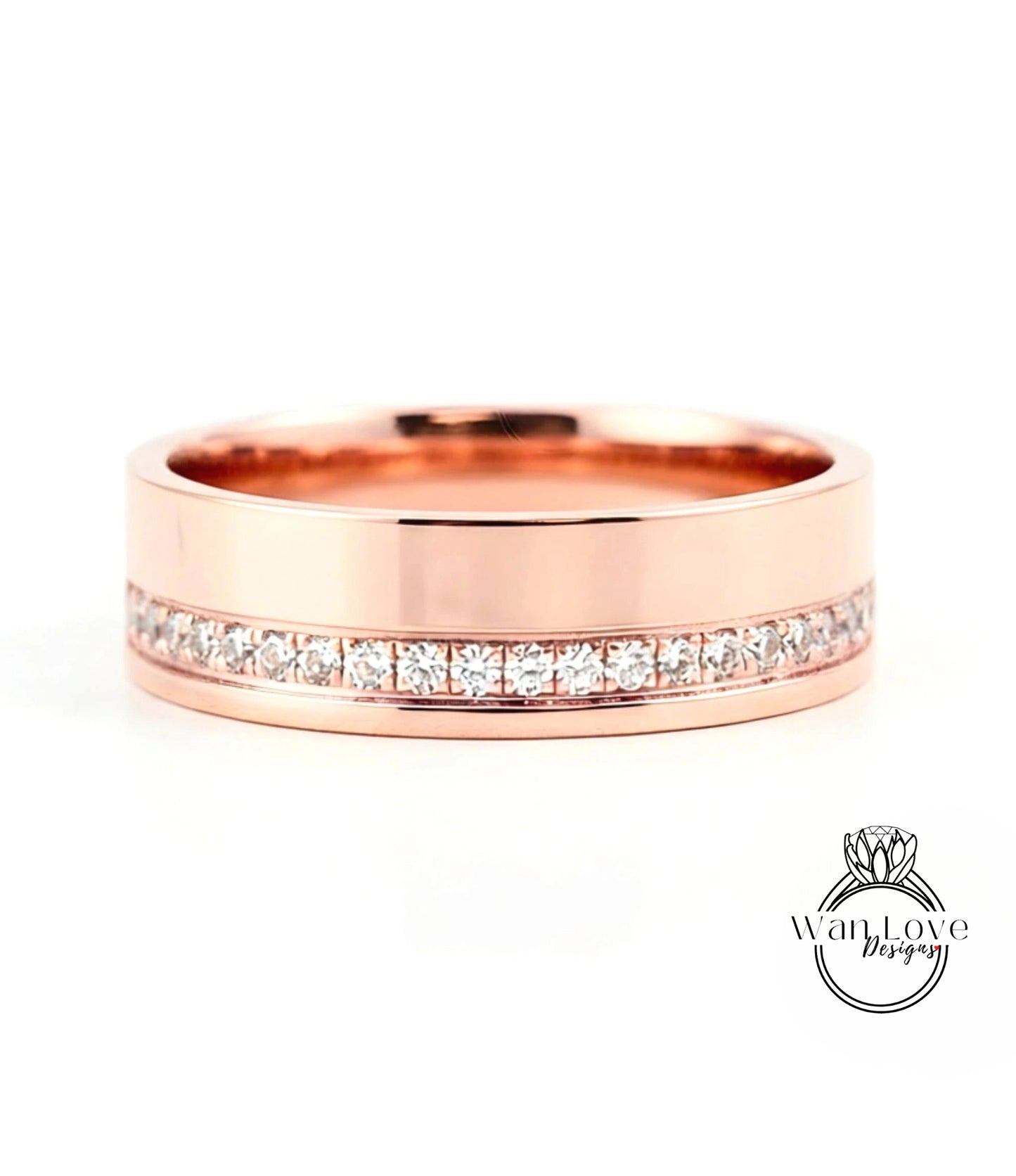 A rose gold wedding band with a row of diamonds set along the inside edge.