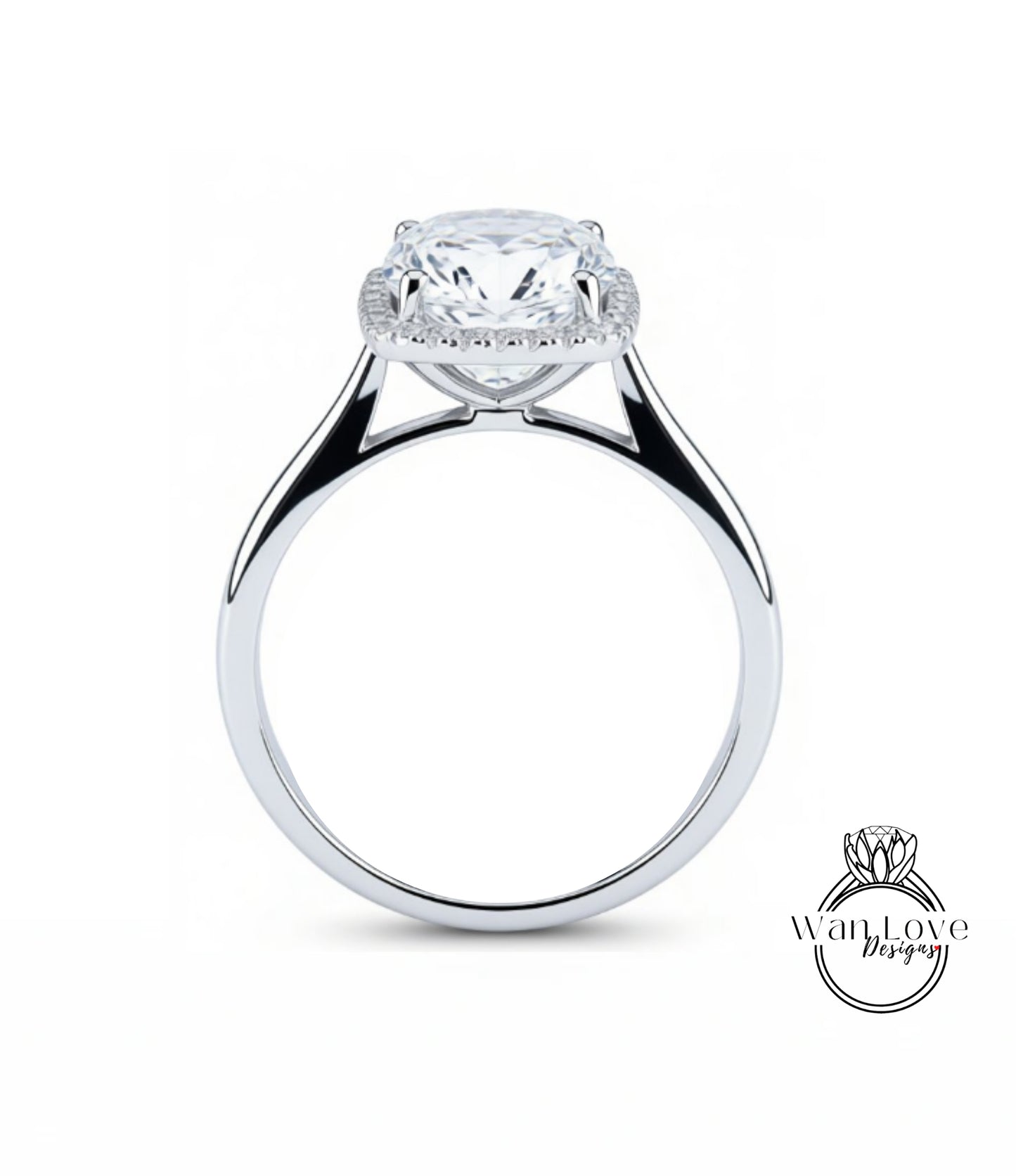 A silver engagement ring with a large, round diamond set in the center, surrounded by a halo of smaller diamonds.