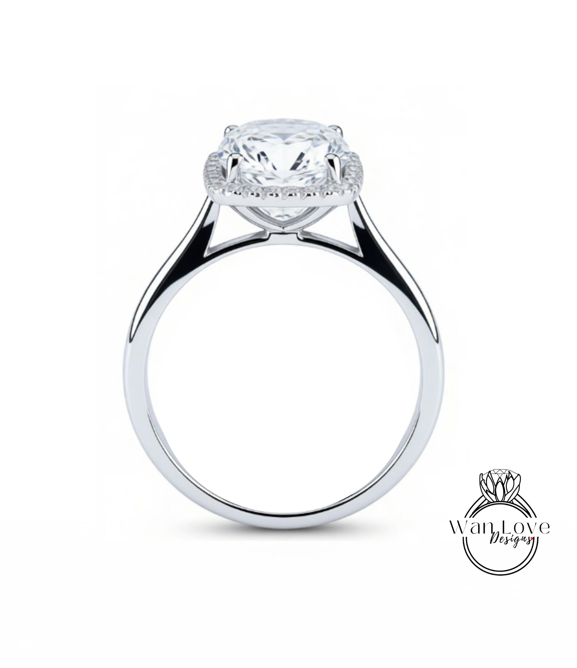 A silver engagement ring with a large, round diamond set in the center, surrounded by a halo of smaller diamonds.