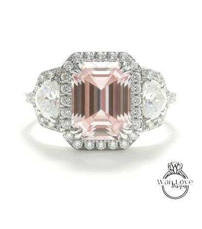A stunning pink gemstone engagement ring with a halo of diamonds around it, set in a silver band.