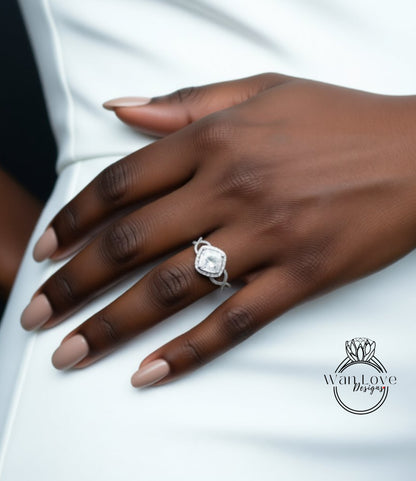 A close-up of a hand wearing a diamond engagement ring.