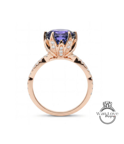 A rose gold ring with a large purple gemstone set in the center, surrounded by smaller diamonds.